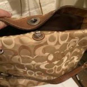 used coach pursewith turn lock closure